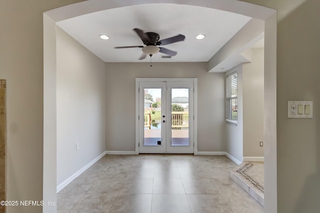 doorway with a ceiling fan, french doors, baseboards, and light tile patterned floors