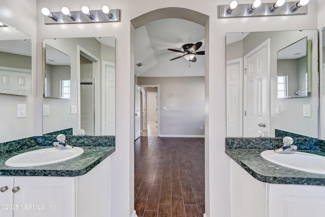 full bath featuring ceiling fan, visible vents, a sink, and wood finish floors