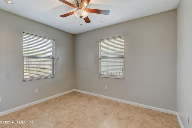 unfurnished room with ceiling fan, light tile patterned floors, recessed lighting, and baseboards