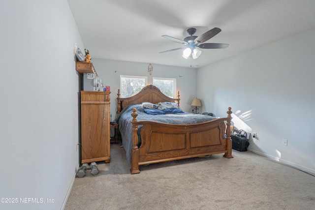 bedroom with ceiling fan, carpet, and baseboards