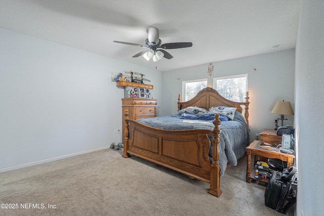 carpeted bedroom featuring a ceiling fan and baseboards