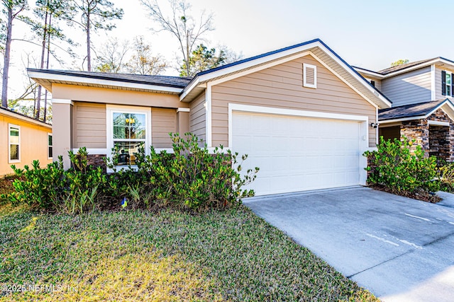 view of front of house featuring a garage and driveway