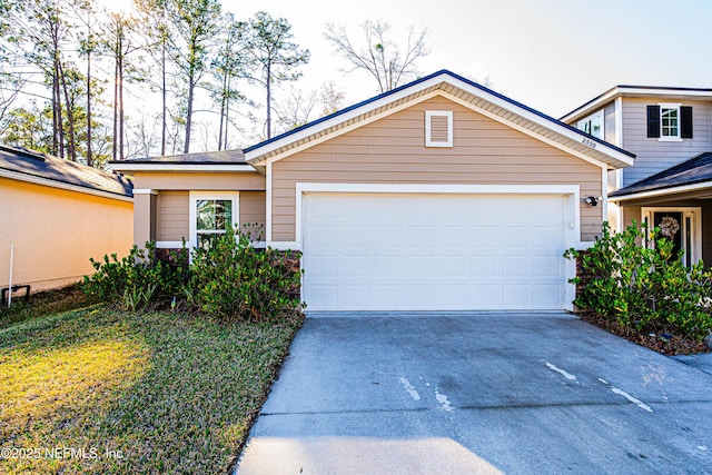 view of front facade featuring concrete driveway and an attached garage