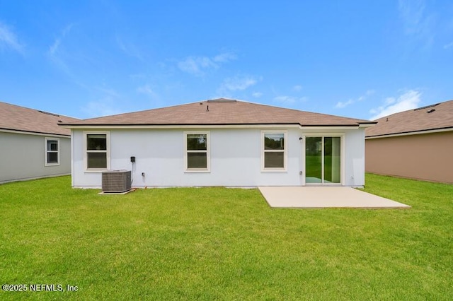 back of property with a yard, a patio, and central AC unit