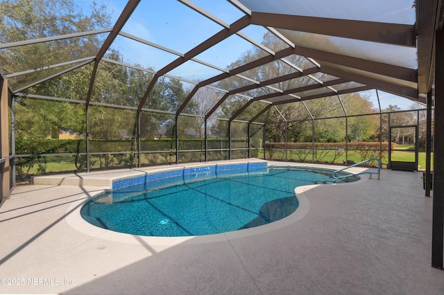 pool featuring a lanai and a patio