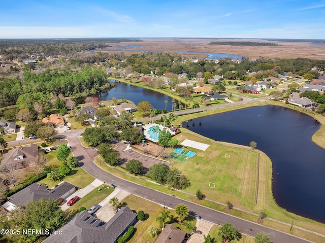 birds eye view of property with a residential view and a water view