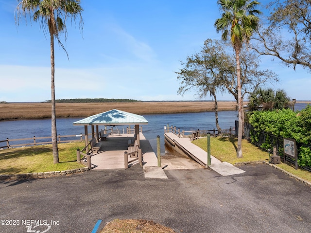 water view featuring fence and a gazebo