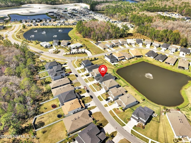 bird's eye view featuring a residential view and a water view