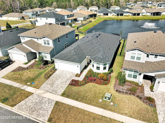 bird's eye view featuring a water view and a residential view