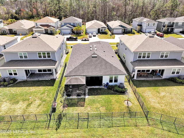 birds eye view of property with a residential view