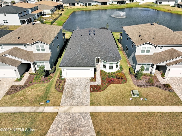 aerial view featuring a water view and a residential view