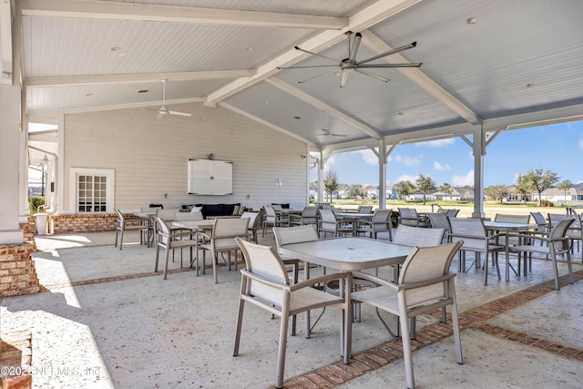 view of patio / terrace with a ceiling fan and outdoor dining space