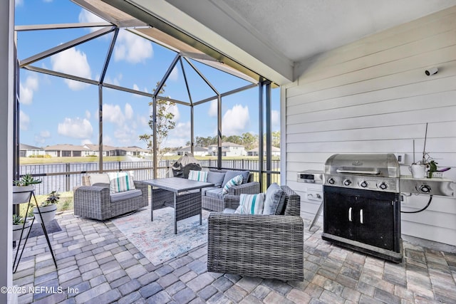 view of patio / terrace with a lanai, fence, an outdoor living space, grilling area, and a residential view