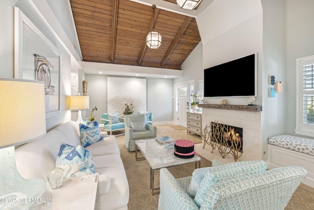 living room with high vaulted ceiling, a fireplace, wood ceiling, baseboards, and beam ceiling