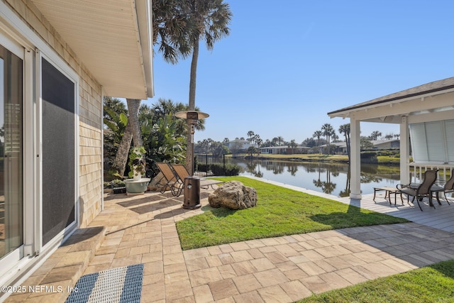 view of patio featuring a water view