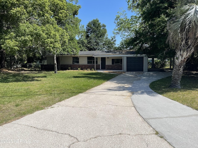 5323 Archery Ave, Jacksonville, FL 32208 - ranch-style house featuring a garage, driveway, brick siding, and a front yard