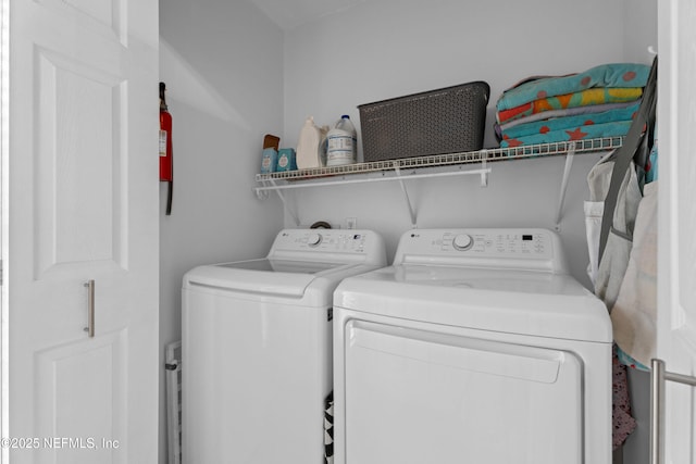 laundry area with laundry area and washer and clothes dryer