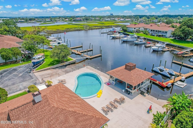 bird's eye view with a residential view and a water view