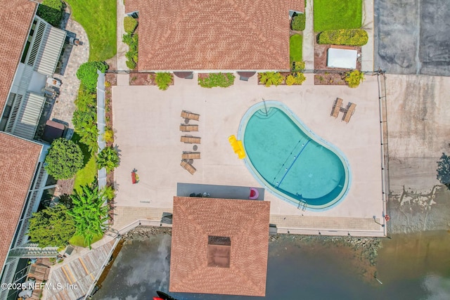 birds eye view of property featuring a water view