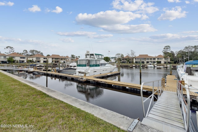 dock area featuring a water view and a residential view