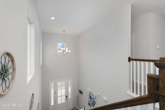 entryway featuring a chandelier and recessed lighting