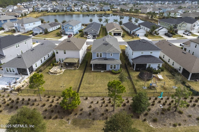 bird's eye view with a residential view and a water view