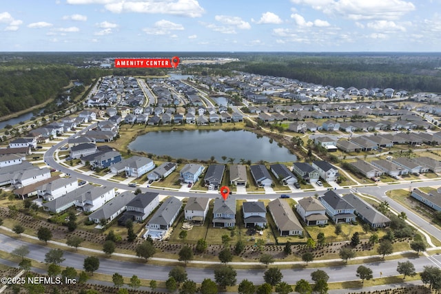 birds eye view of property with a residential view and a water view