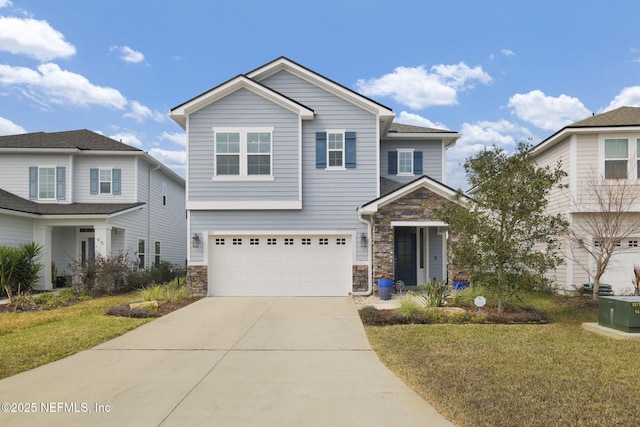 view of front of house featuring stone siding, a front lawn, and concrete driveway