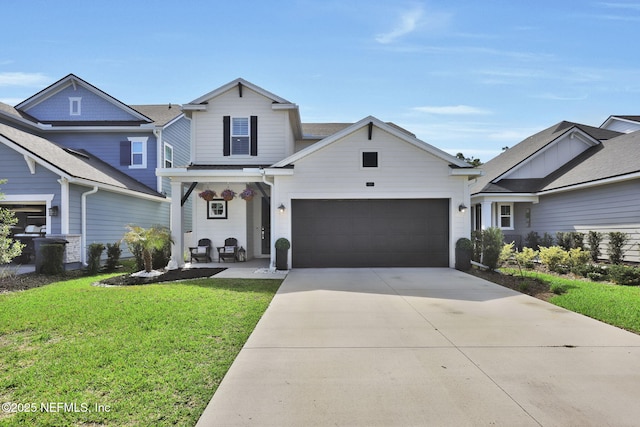 traditional-style house with driveway, a garage, and a front yard