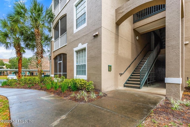 property entrance featuring stucco siding