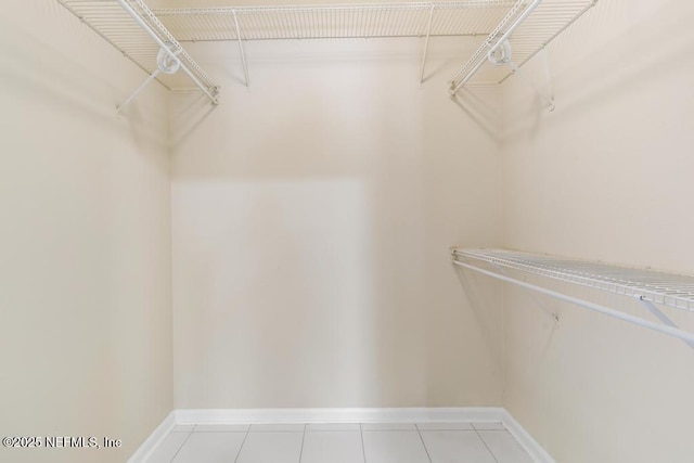 spacious closet with tile patterned flooring