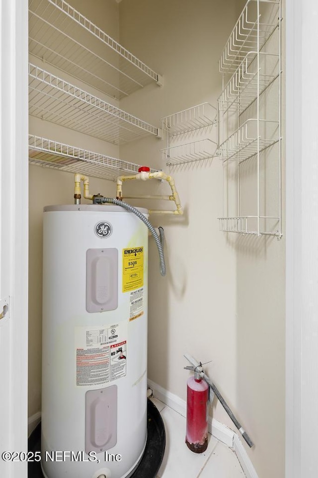 utility room with water heater