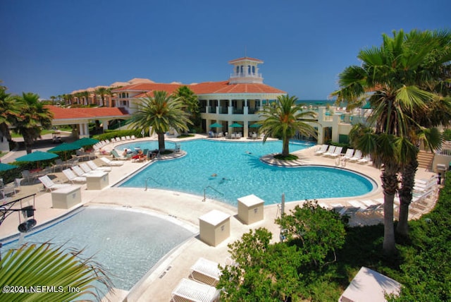 community pool with a patio