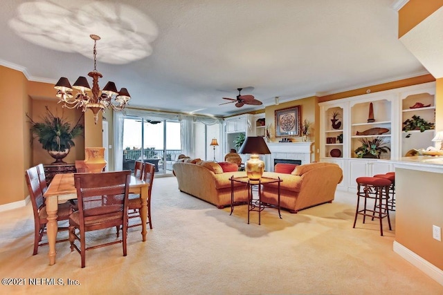 living room featuring light carpet, ornamental molding, a fireplace, and baseboards