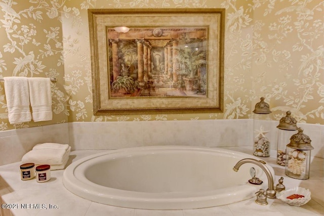 full bath featuring wallpapered walls and a bathtub