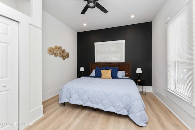 bedroom with recessed lighting, wood finished floors, a ceiling fan, and baseboards