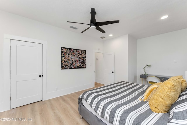 bedroom featuring a ceiling fan, visible vents, wood finished floors, and recessed lighting