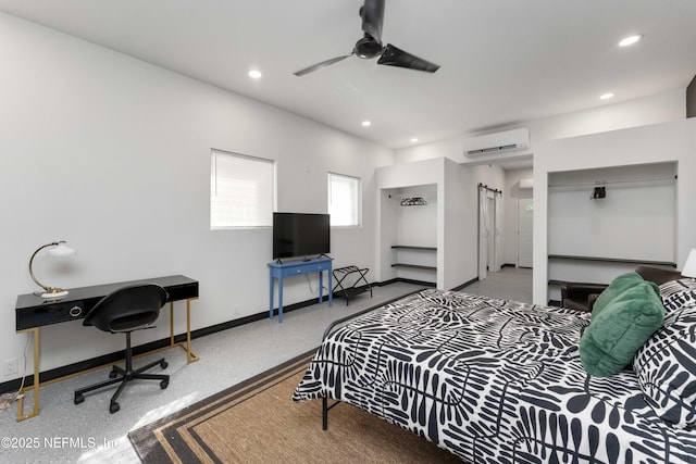 bedroom with a wall unit AC, ceiling fan, baseboards, and recessed lighting