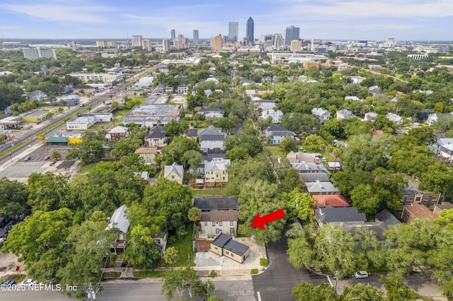 birds eye view of property featuring a city view