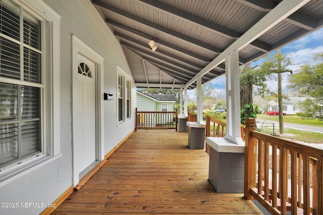 wooden deck featuring covered porch