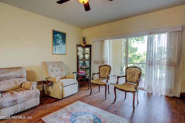 sitting room featuring ceiling fan and wood finished floors