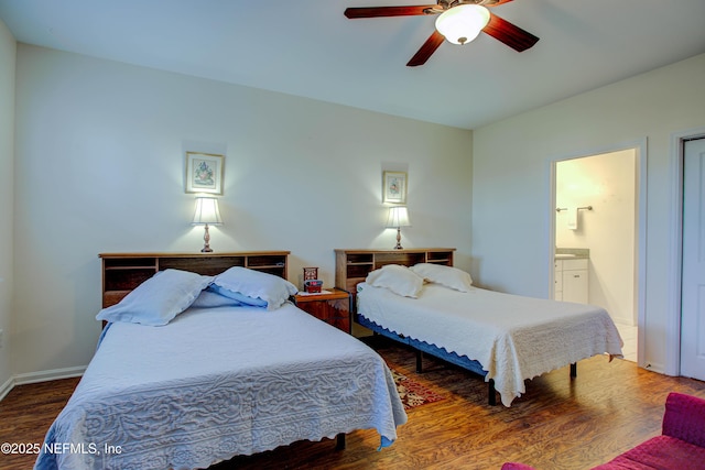 bedroom featuring a ceiling fan, baseboards, wood finished floors, and ensuite bathroom