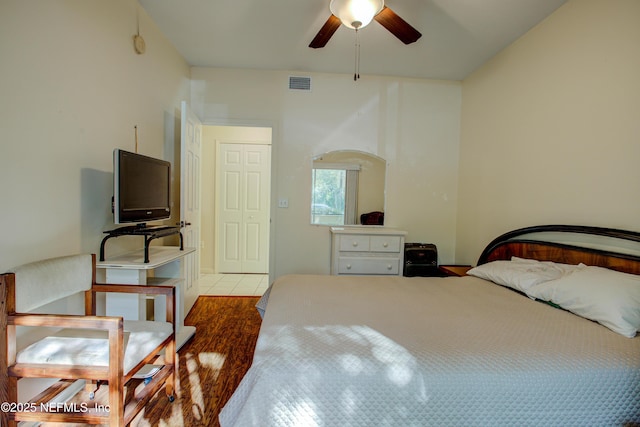 bedroom featuring light tile patterned floors, ceiling fan, and visible vents