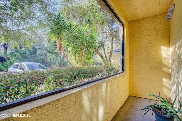 unfurnished sunroom with a wealth of natural light