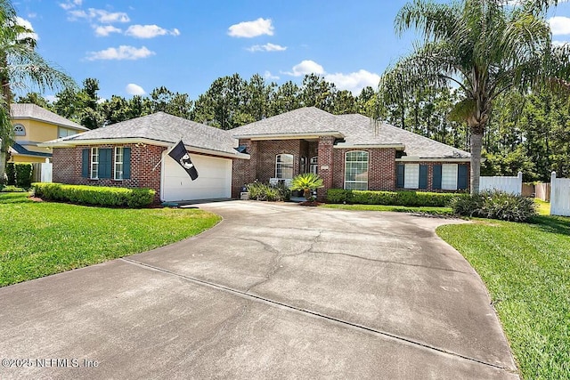 view of front of property with driveway, an attached garage, fence, a front lawn, and brick siding