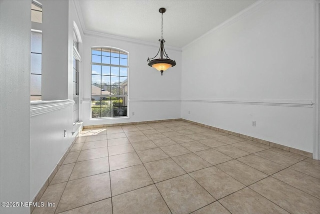 unfurnished dining area featuring baseboards, a textured ceiling, tile patterned flooring, and crown molding