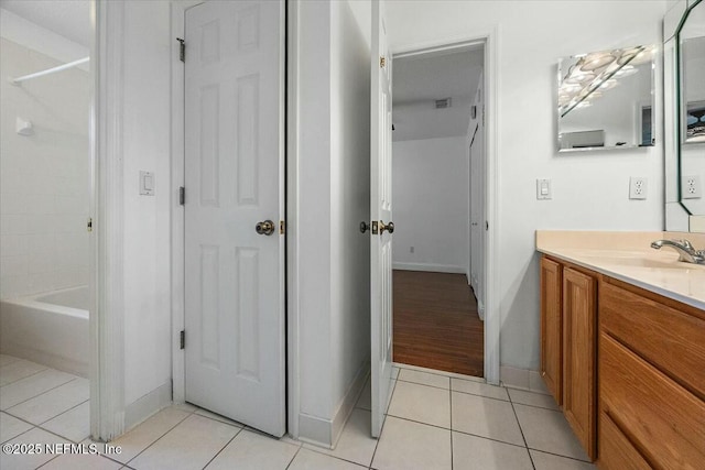 bathroom with visible vents, shower / bathing tub combination, vanity, and tile patterned floors