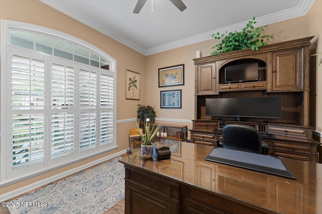 office area with ceiling fan, ornamental molding, and baseboards