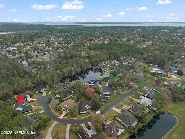 drone / aerial view with a water view and a residential view