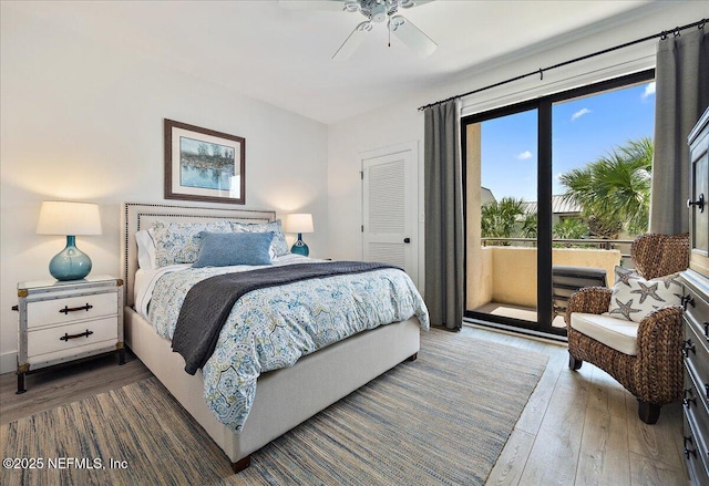 bedroom with wood finished floors, a ceiling fan, and access to outside